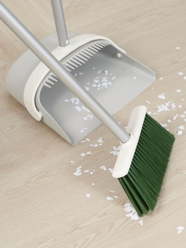 A grey/green PEPPRIG dustpan/broom
