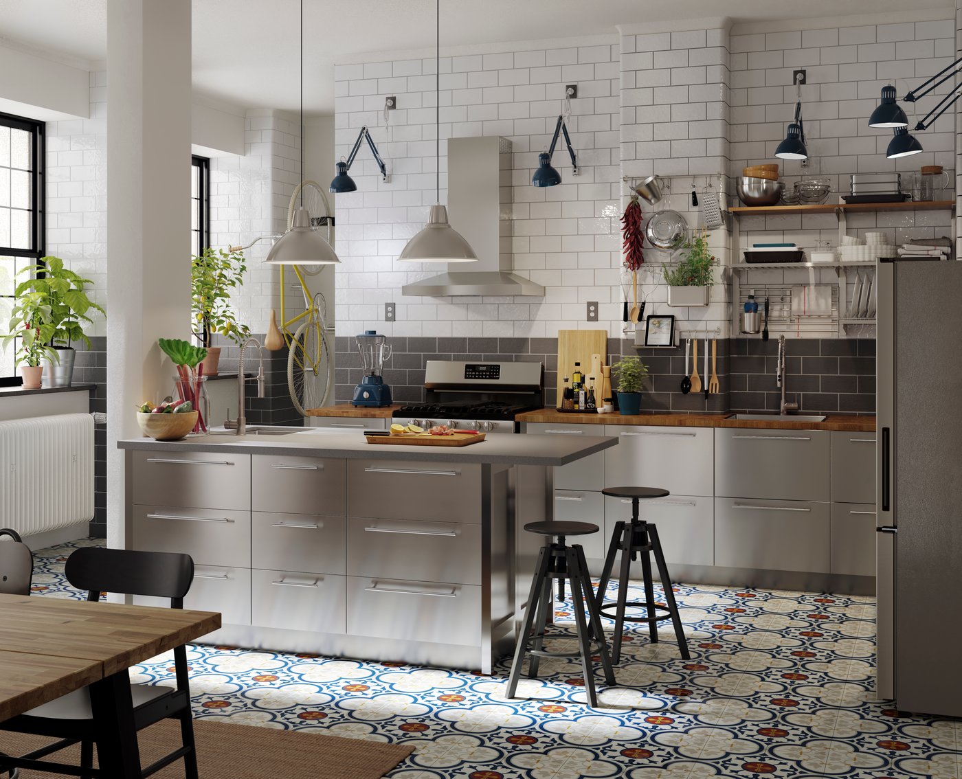 A kitchen with stainless steel VÅRSTA kitchen fronts.