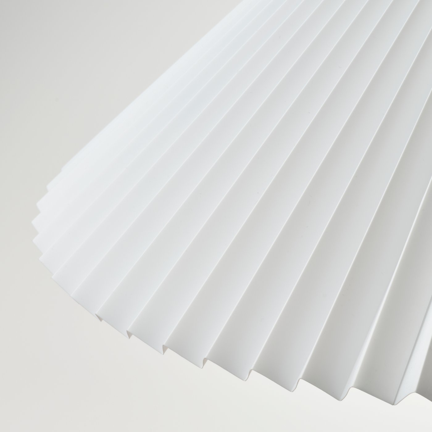 A pleated white KUDDLAVA pendant lampshade