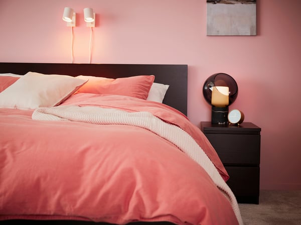 A marble/grey globe EVEDAL table lamp in the bedroom
