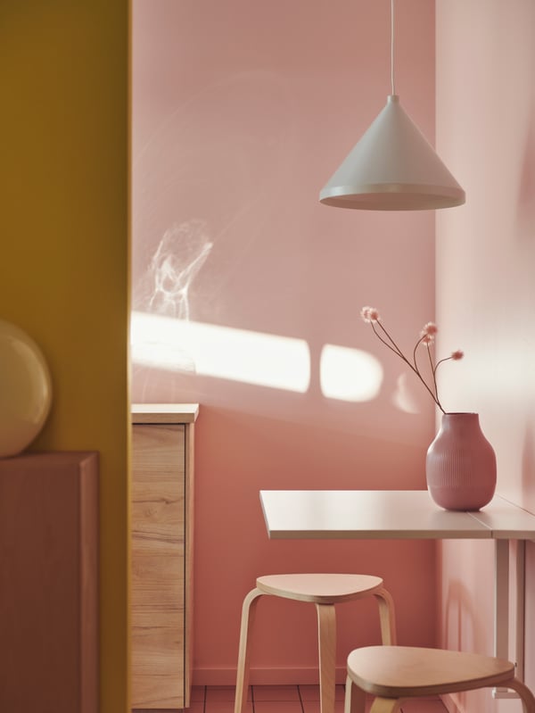 A white NORBERG wall-mounted drop-leaf table