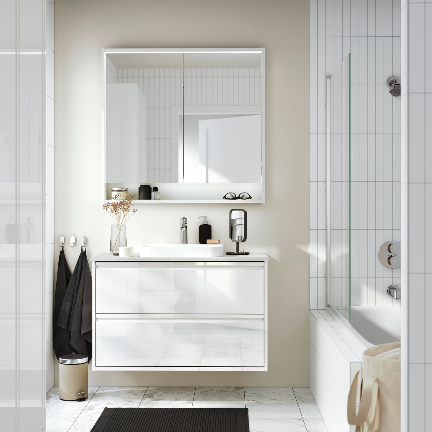 A high-gloss white/white marble effect BACKSJÖN wash-stnd w drawers/wash-basin/tap in the bathroom
