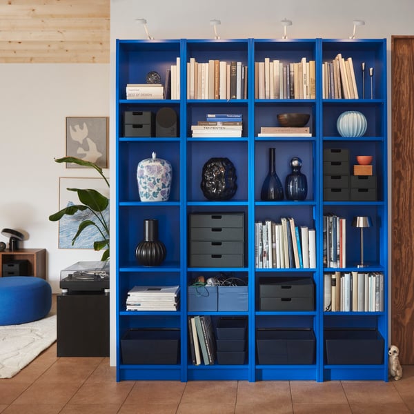 A blue BILLY bookcase in the living room