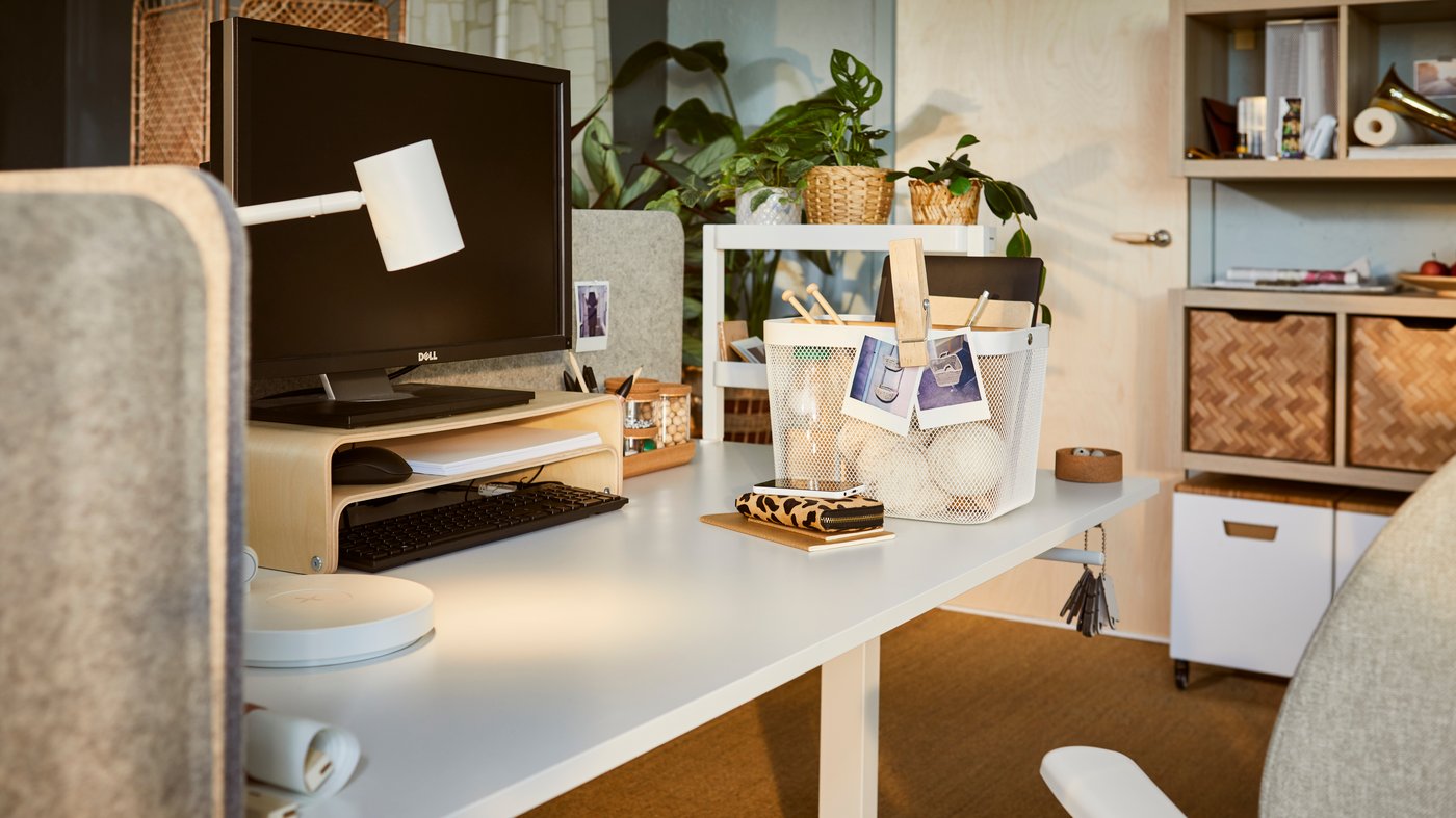 image from a desk with a computer and small storage options.