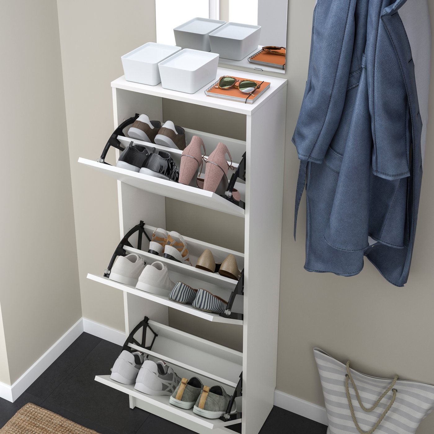 A white BISSA shoe cabinet with 3 compartments in the hallway