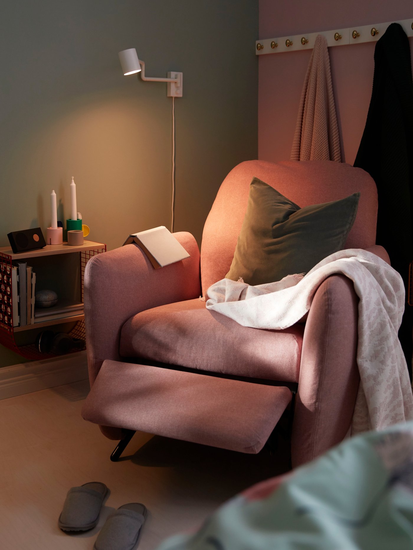 A quiet room with a pink EKOLSUND armchair.
