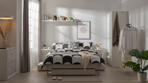 A white BRUKSVARA bed storage box