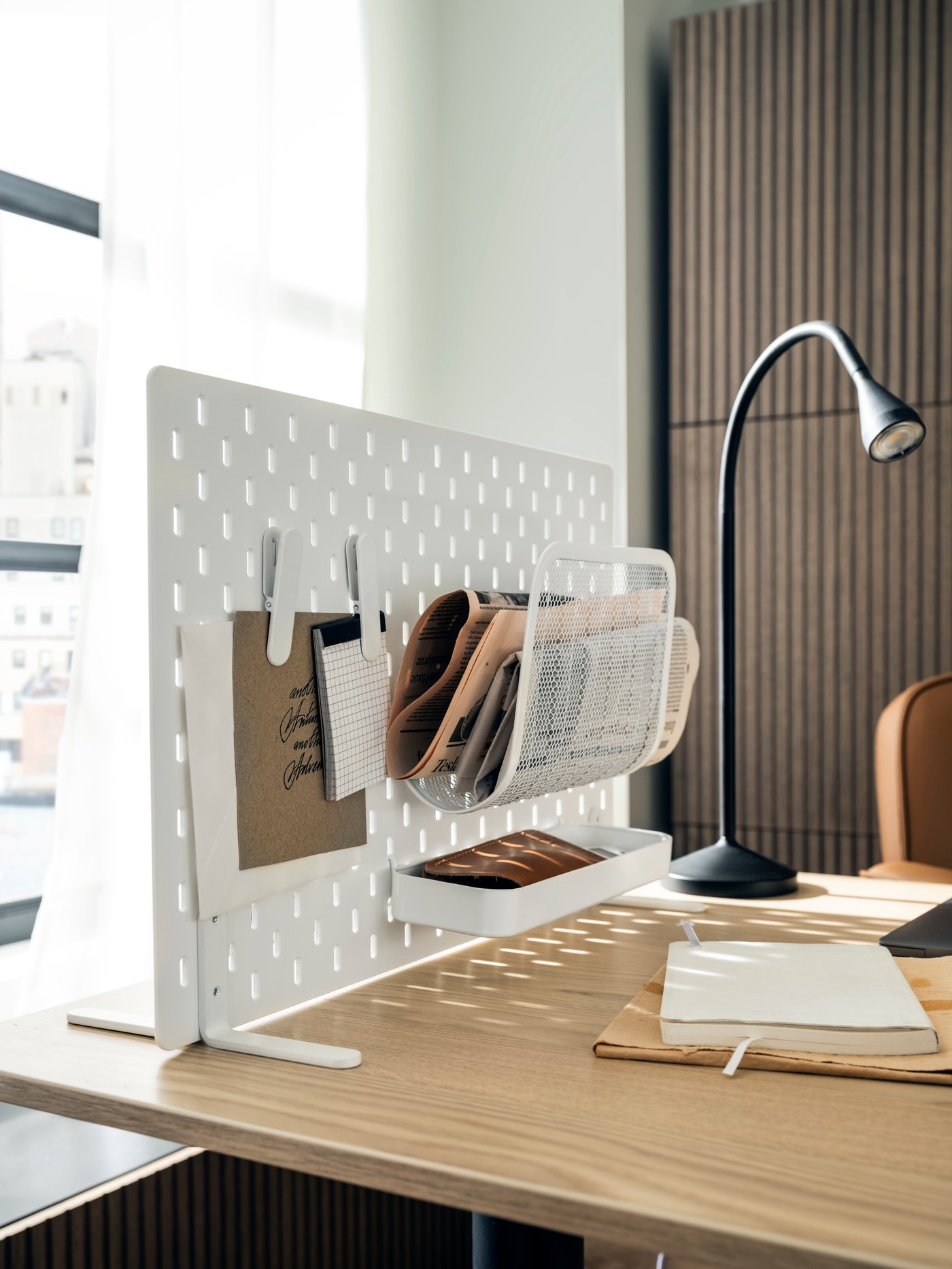A white SKÅDIS shelf