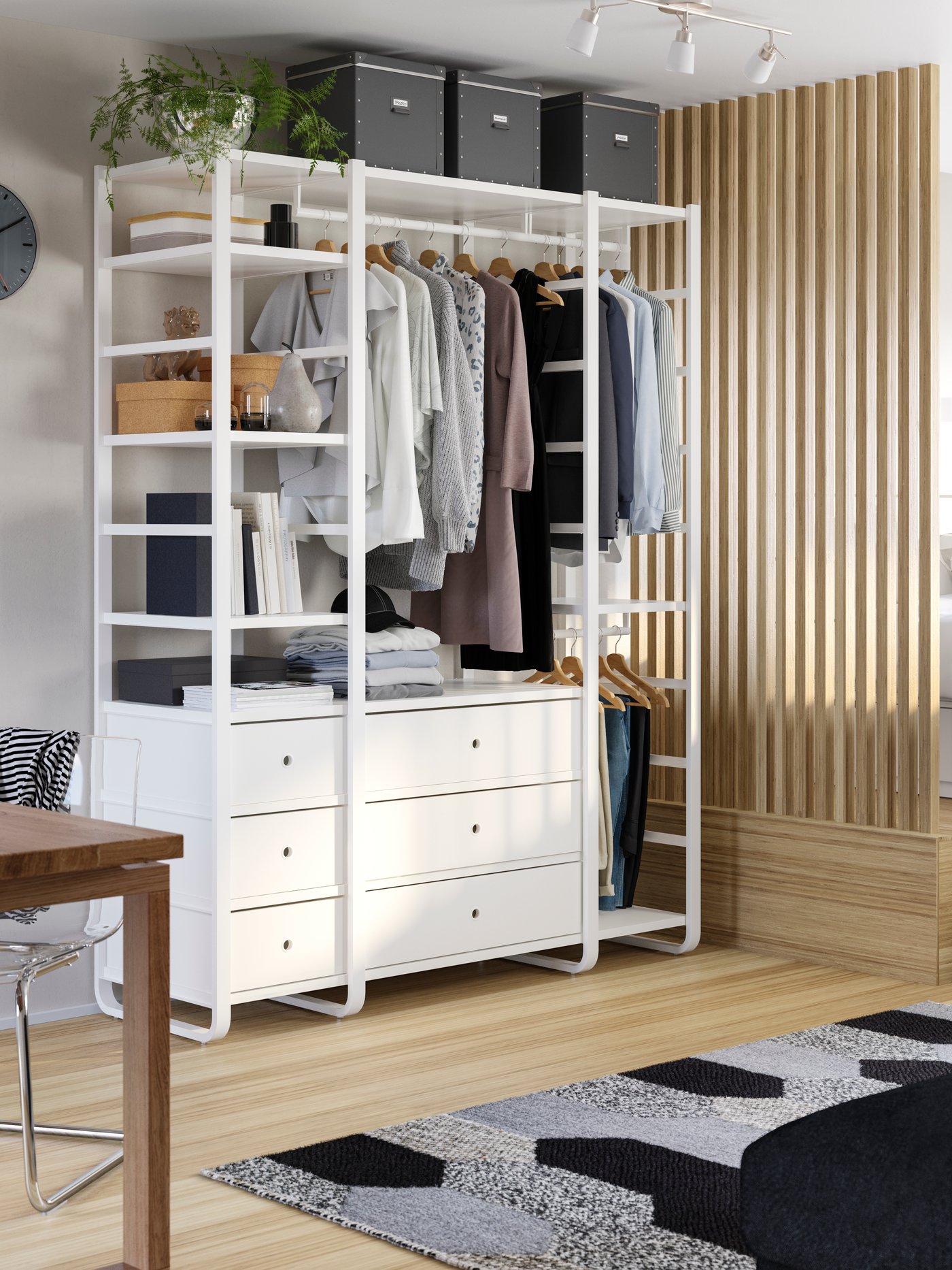 A dark grey FJÄLLA storage box with lid in the bedroom.