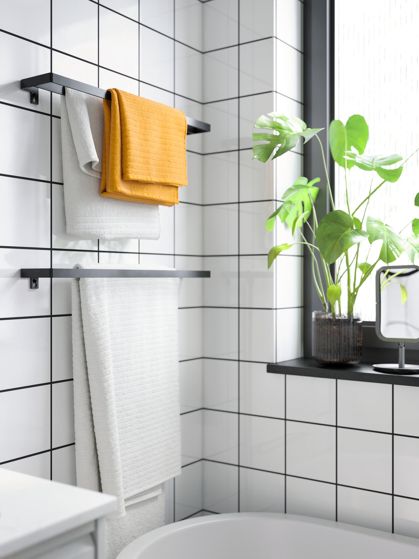 A white VÅGSJÖN hand towel in the bathroom