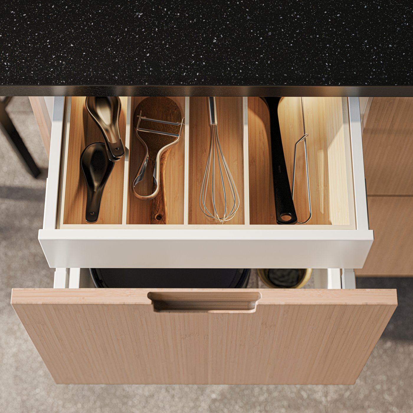 A stainless steel PÅBJUDA whisk in the kitchen