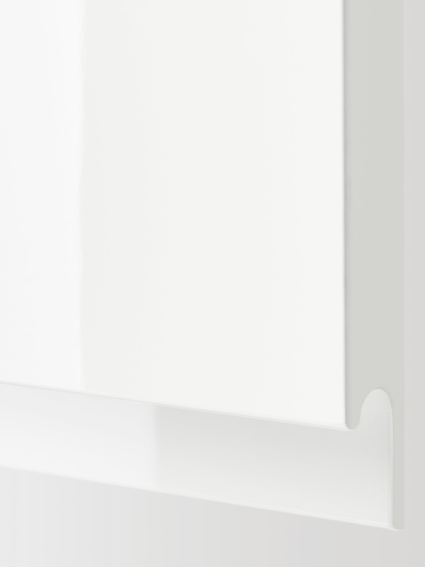 A high-gloss white VOXTORP door