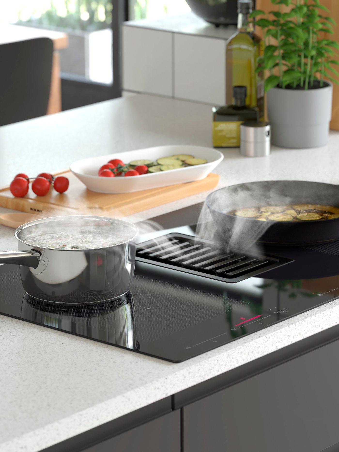 An IKEA 700 black FÖRDELAKTIG induction hob/integrated extractor in the kitchen.