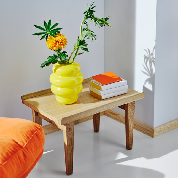 A Kelinge orange DYVLINGE swivel easy chair