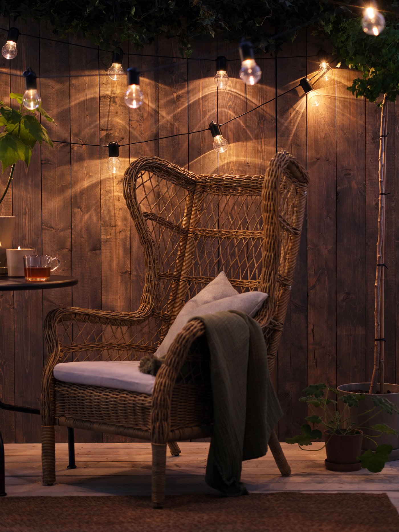 A brown RISHOLMEN wing chair, in/outdoor
