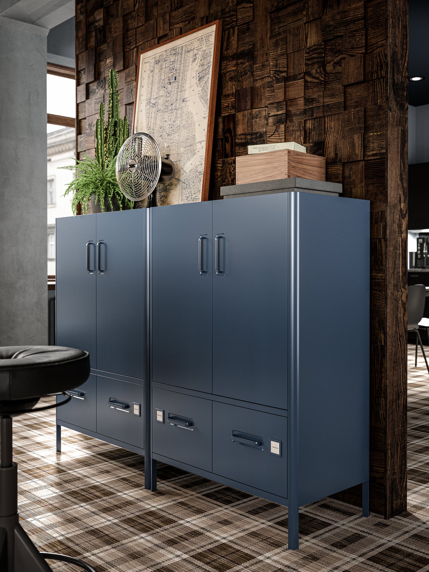 Two dark blue cabinets with doors and drawers with boxes, a framed old map, plants and a retro electric fan on top.