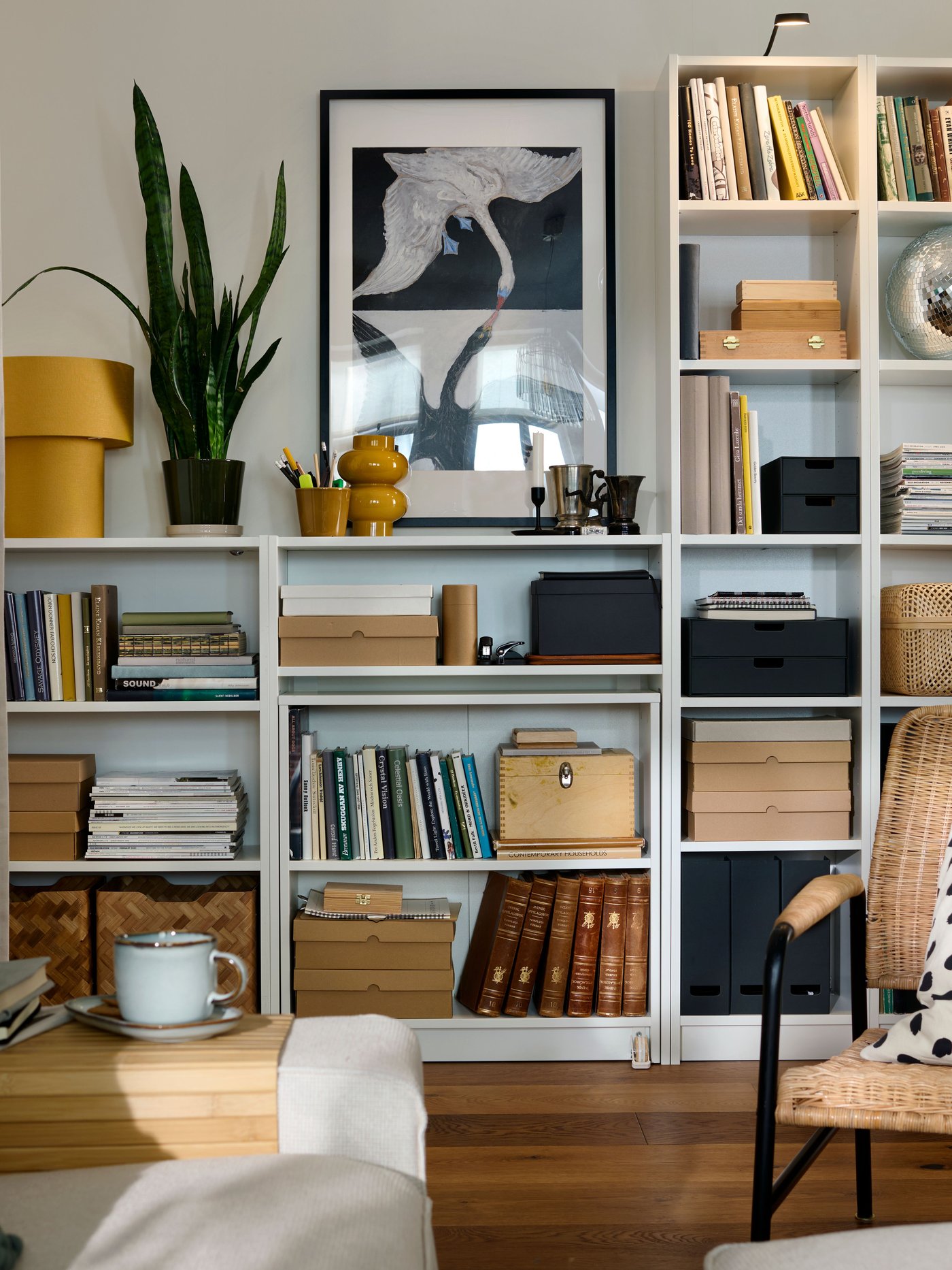 A white BILLY bookcase with height extension unit in the living room