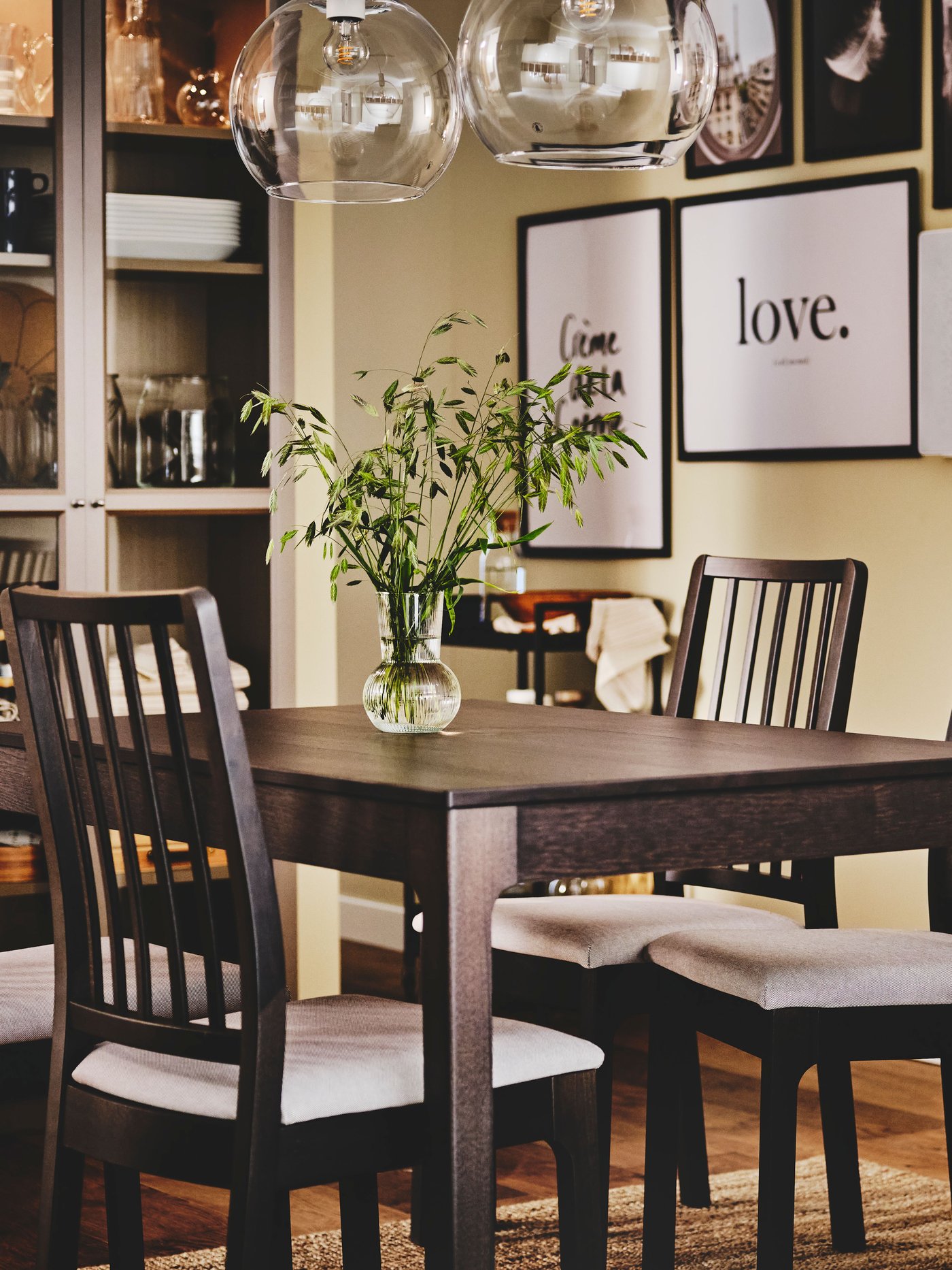A dark brown EKEDALEN extendable table