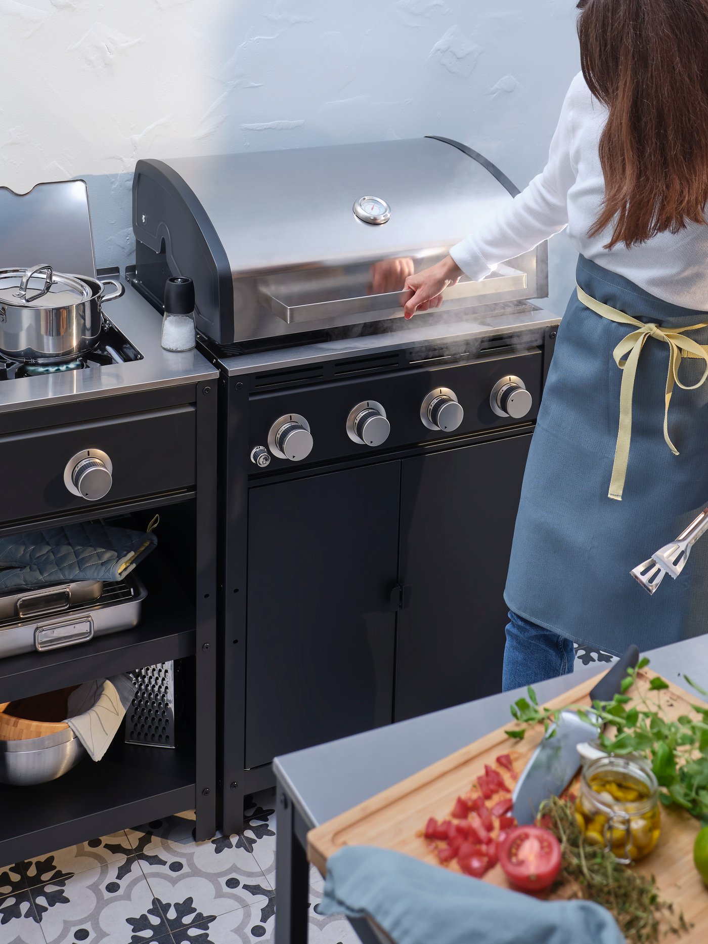A gas barbecue/side burner/stainless steel GRILLSKÄR outdoor kitchen outside