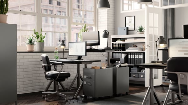 A dark grey IDÅSEN drawer unit on castors