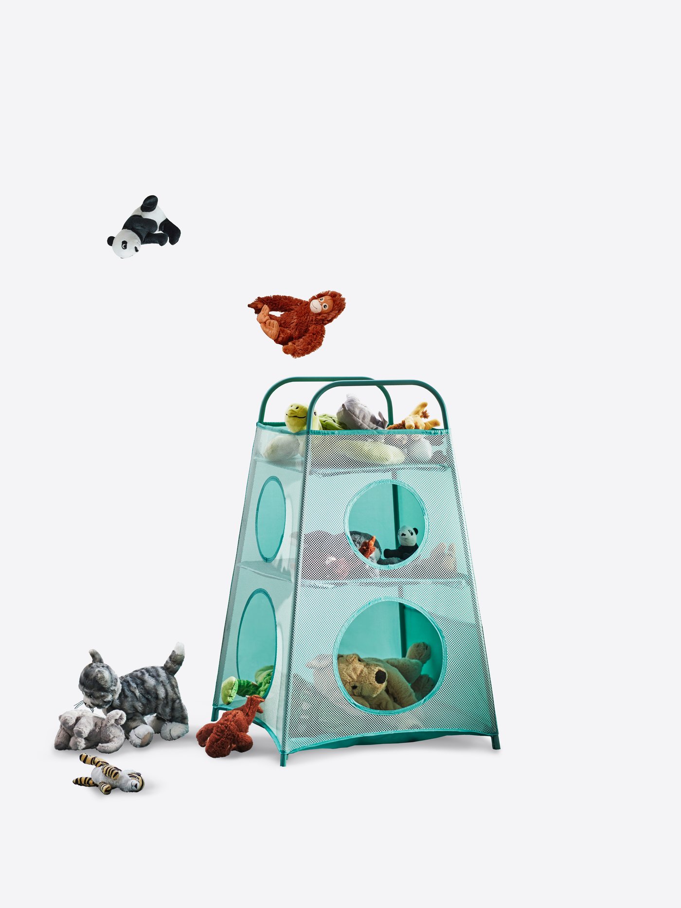 Soft toys are flying towards a turquoise TIGERFINK storage with soft toys stored inside and on the floor beside it.