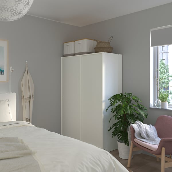 A white KLEPPSTAD wardrobe with sliding doors