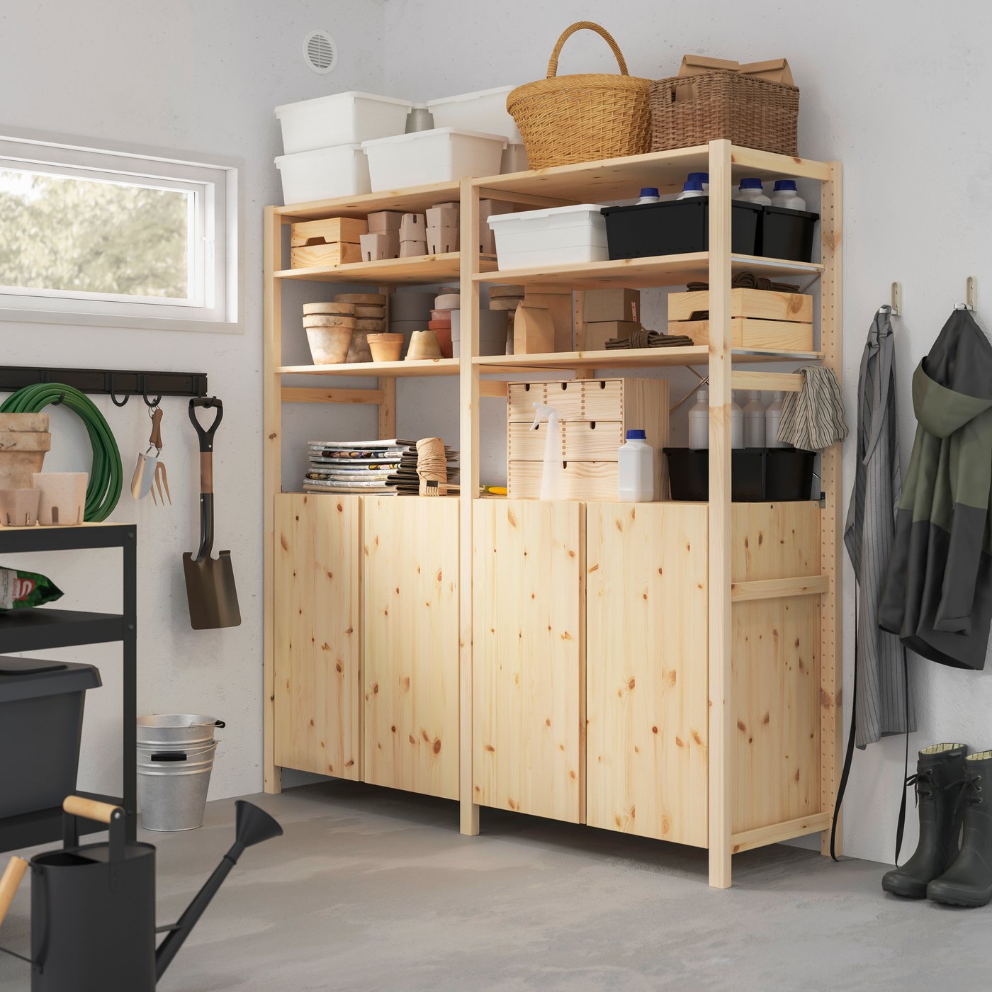 A pine IVAR 2 sections/shelves/cabinet in the garage