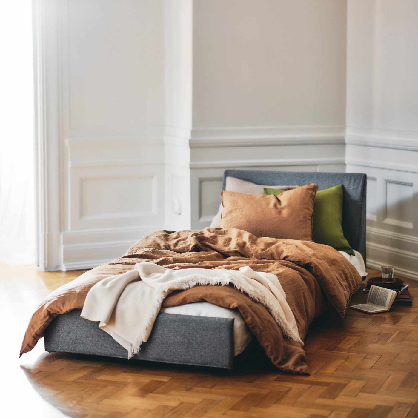 A red-brown DYTÅG cushion cover