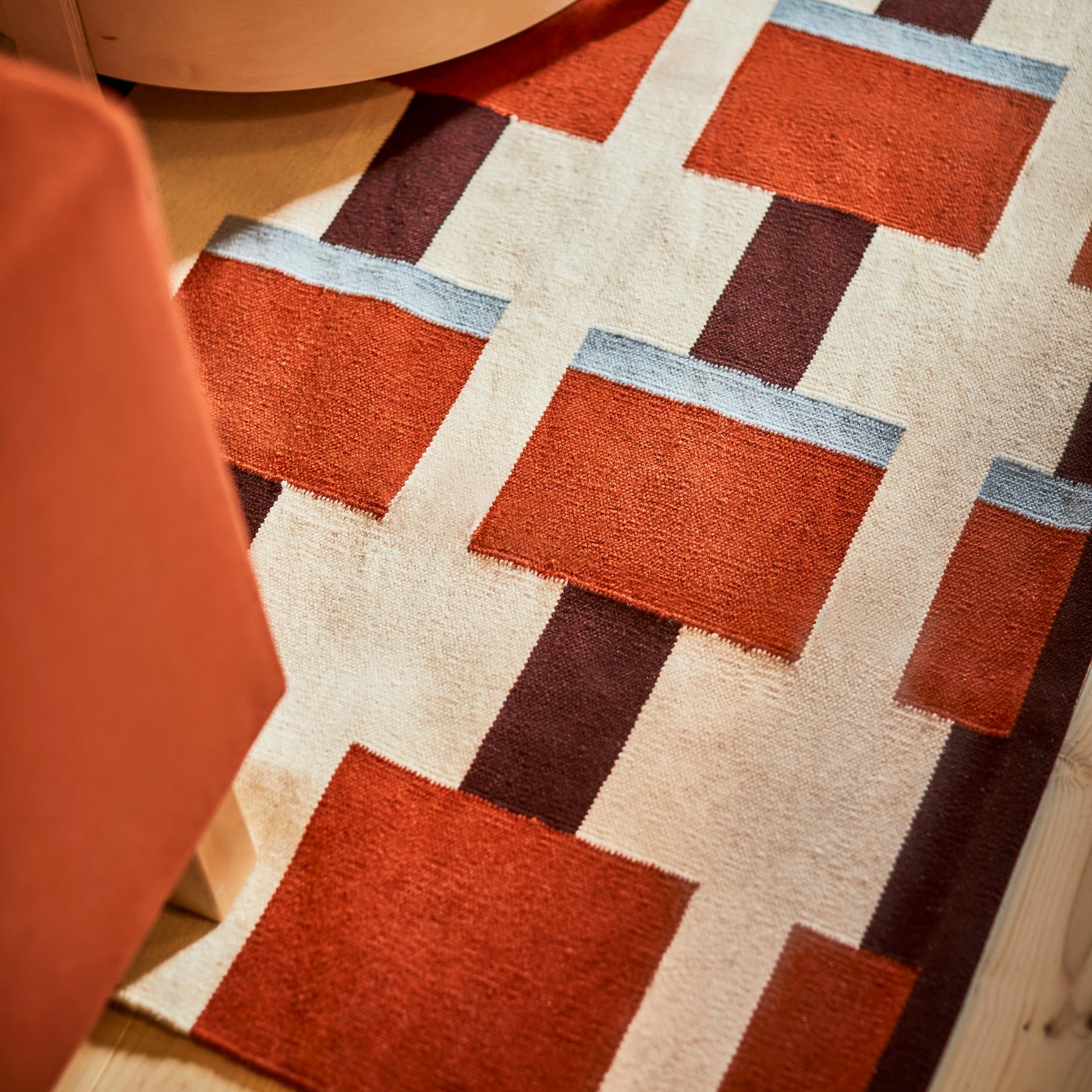 A white/brown/light blue handwoven STOCKHOLM 2025 rug, flatwoven in the NA
