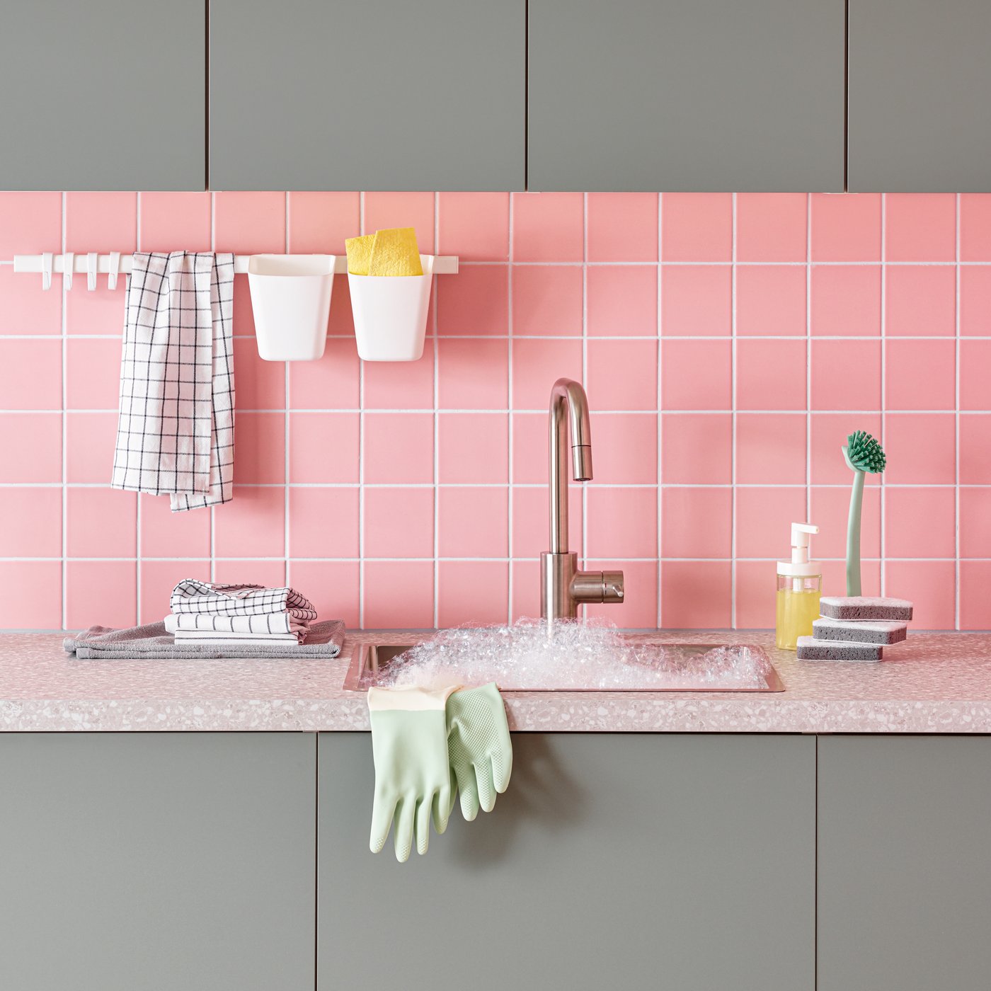 A white/dark grey/patterned RINNIG tea towel in the kitchen