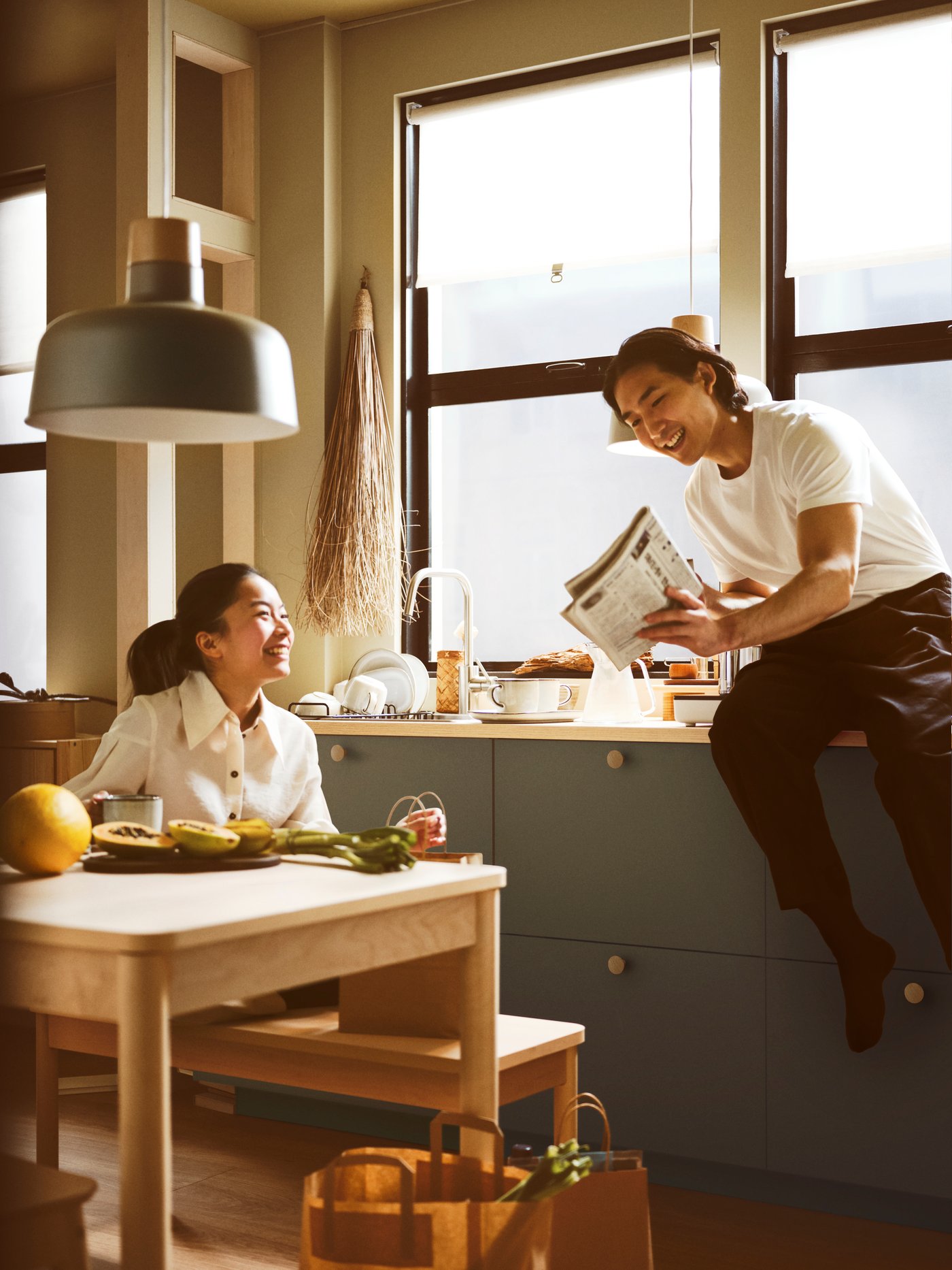 2 people sharing a book in the dining room