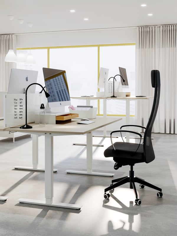 A white ELLOVEN monitor stand with drawer