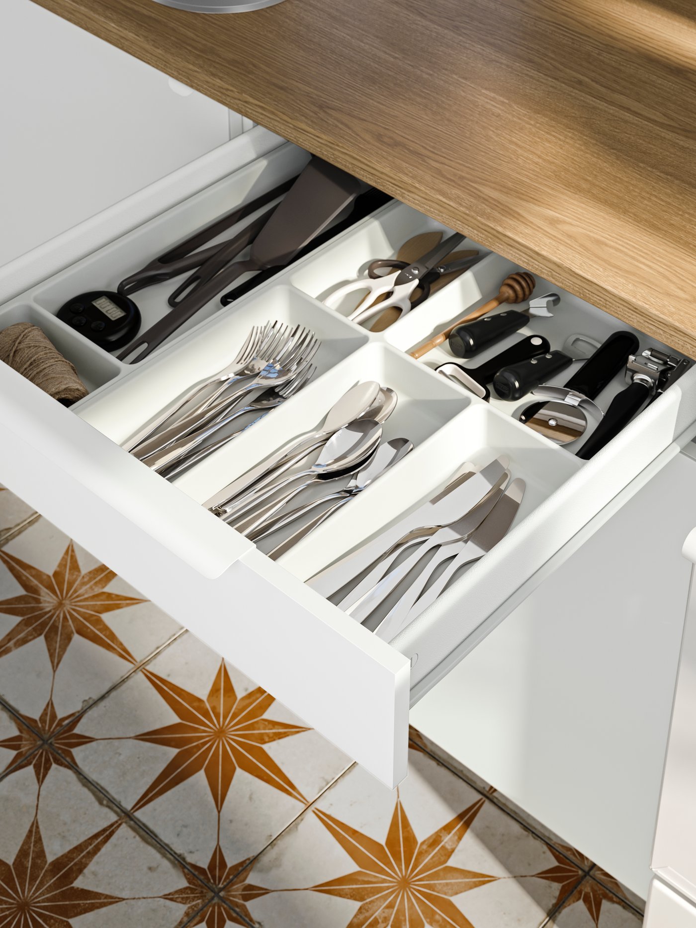 A white STÖDJA cutlery tray in the kitchen