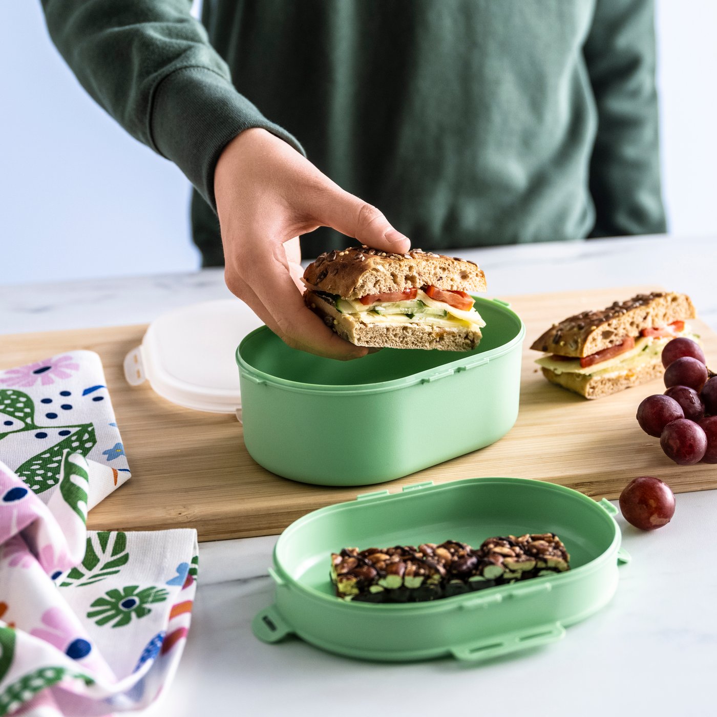 A light green UTBJUDA stackable lunch box for dry food in the NA