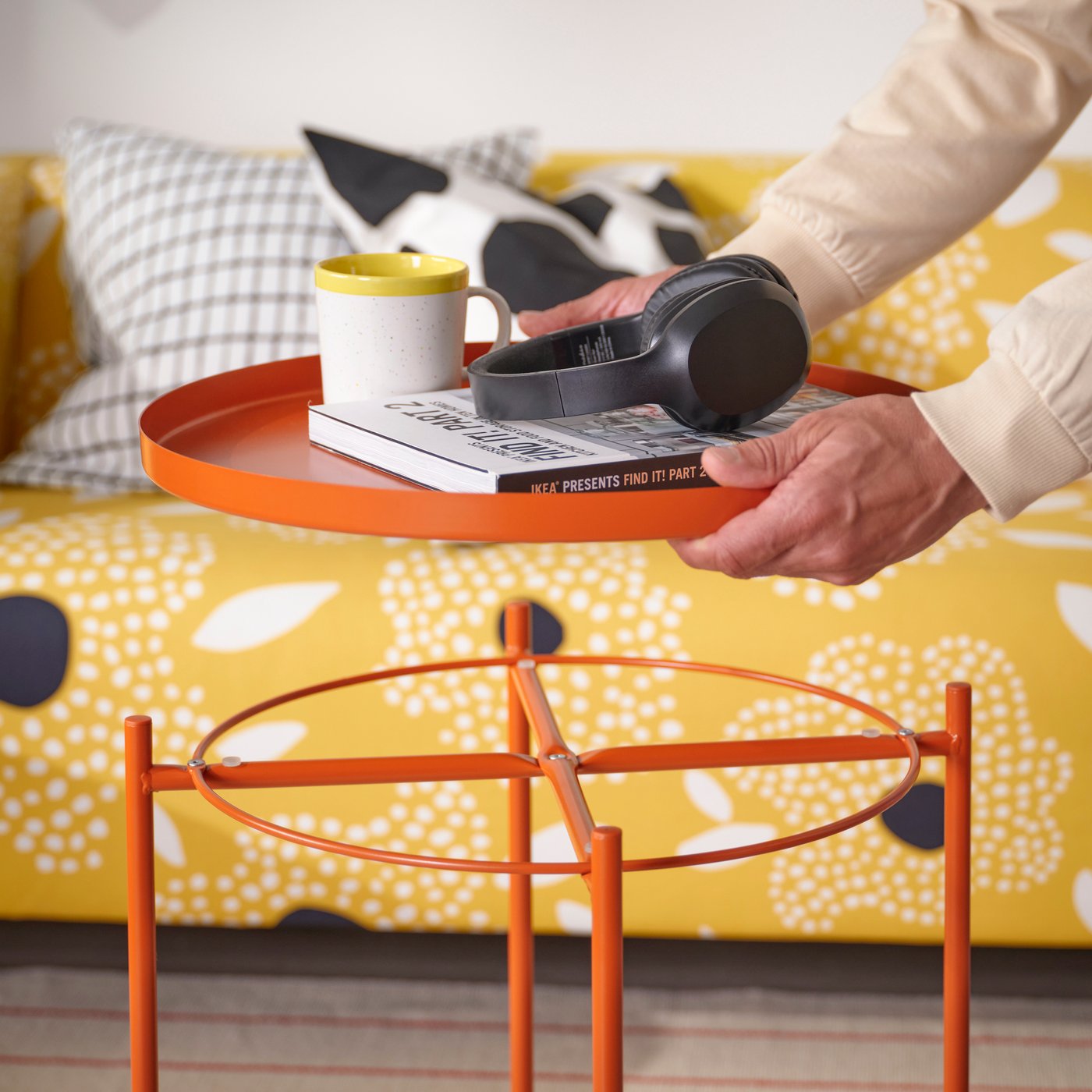 A bright orange GLADOM tray table