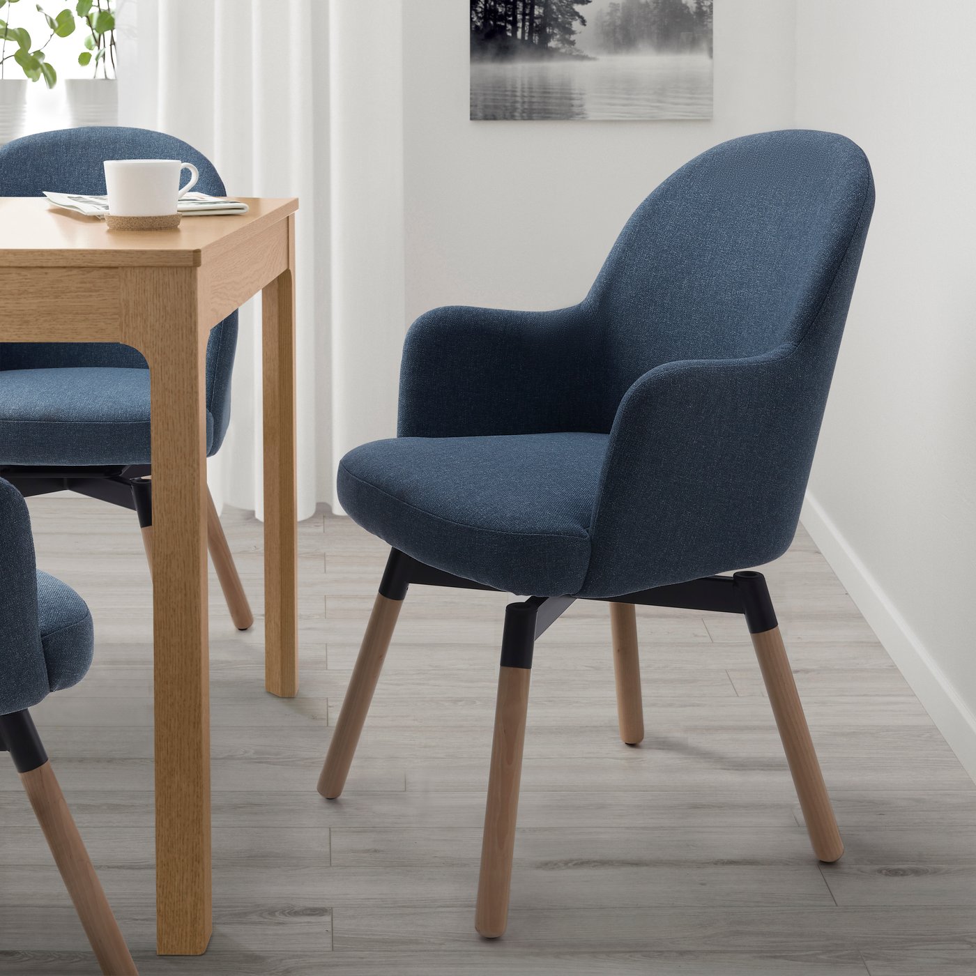 A Gunnared blue JANOLOF swivel dining armchair
