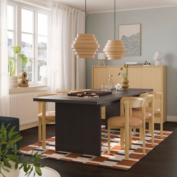 A dark brown ash veneer BERGSHYTTAN table