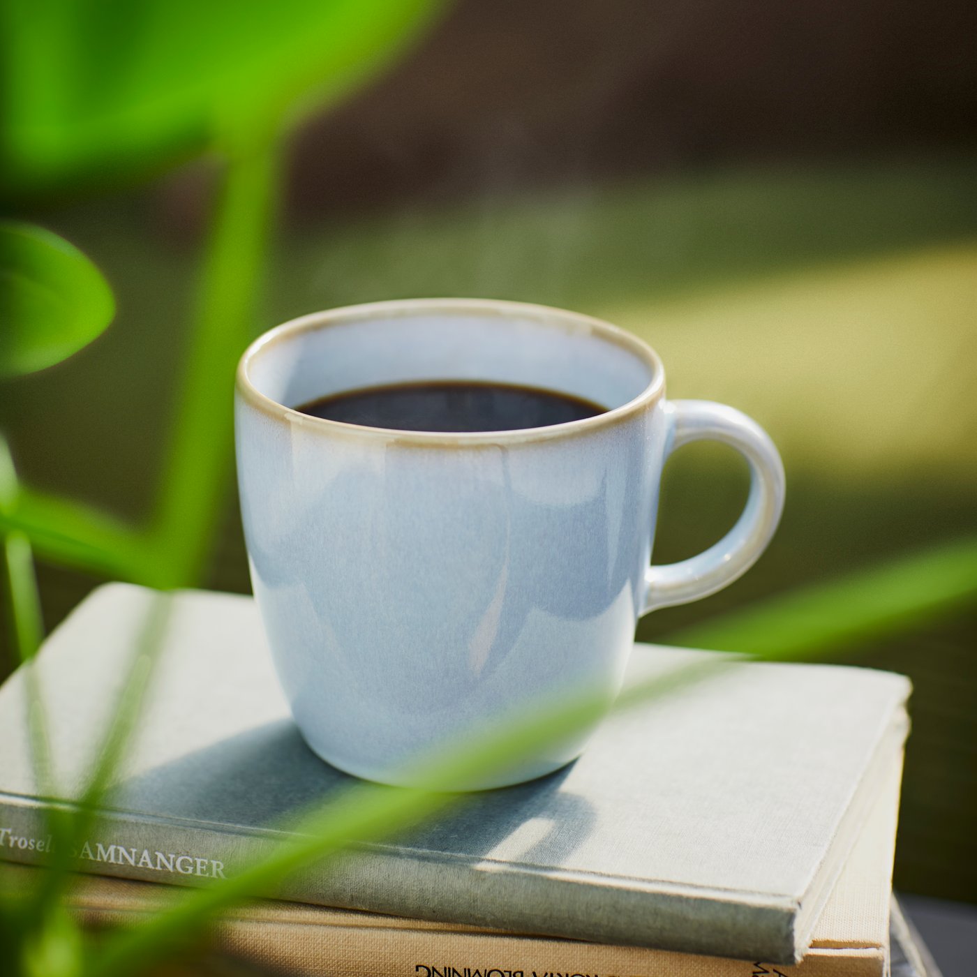 A light blue FÄRGKLAR mug