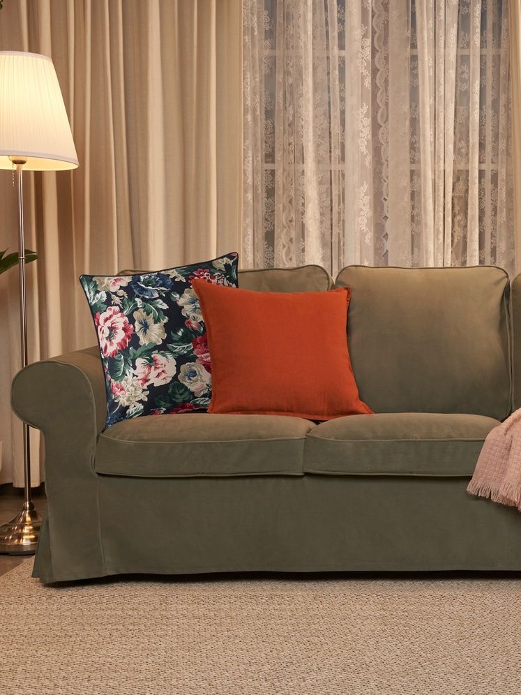 A Hakebo grey-green EKTORP 3-seat sofa in the living room