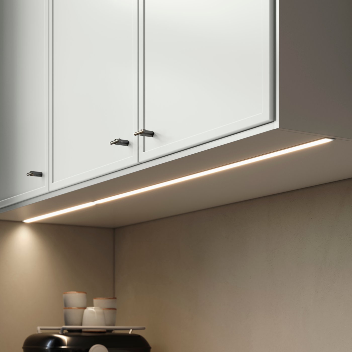 ASPUDDEN cover panel for lighting mounted under light grey cabinets, brightening the kitchen wall.