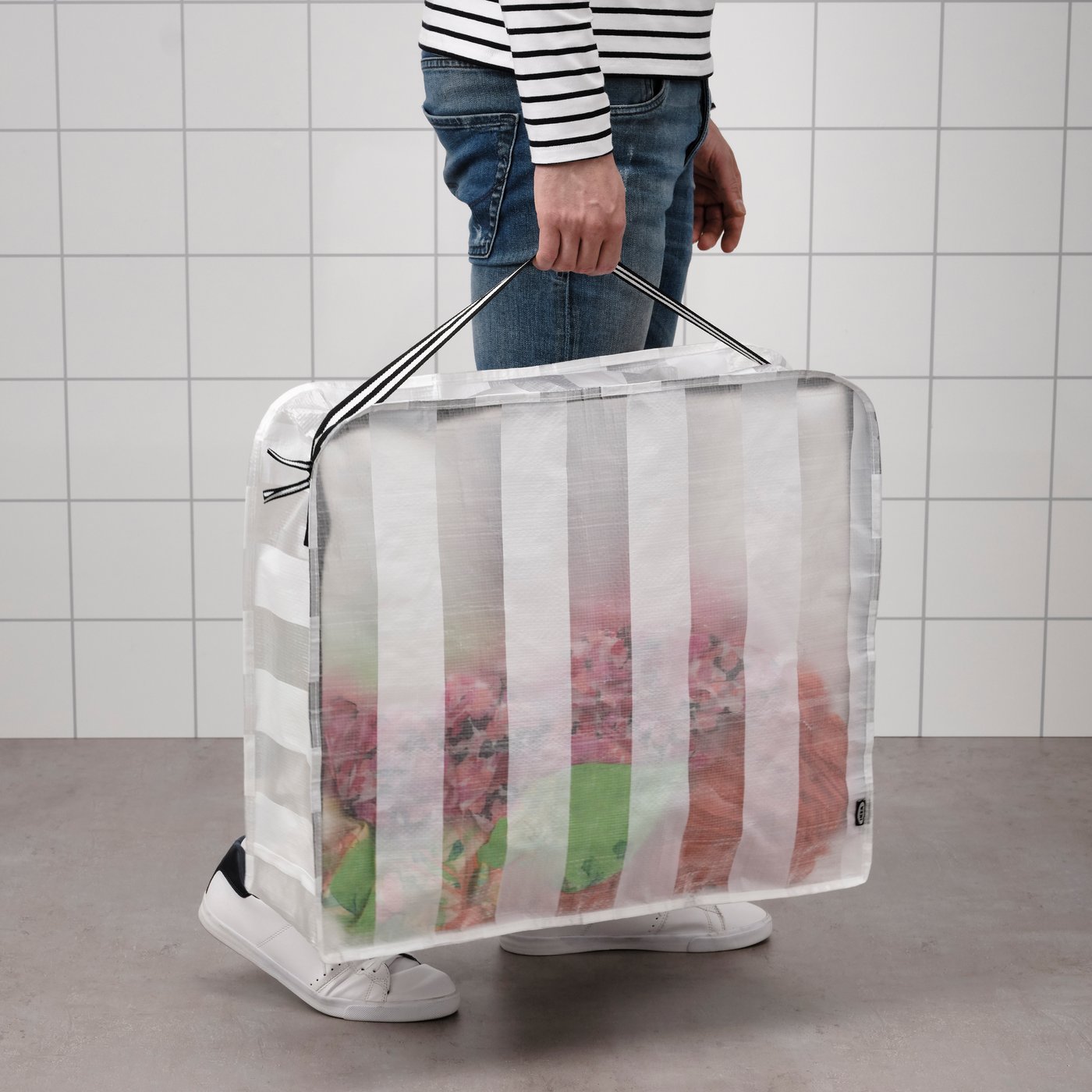 A white/transparent GÖRSNYGG storage case