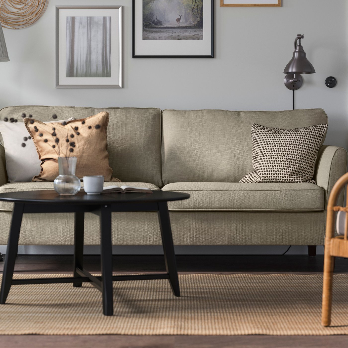 A Hakebo beige EKHOLMA 3-seat sofa in the living room