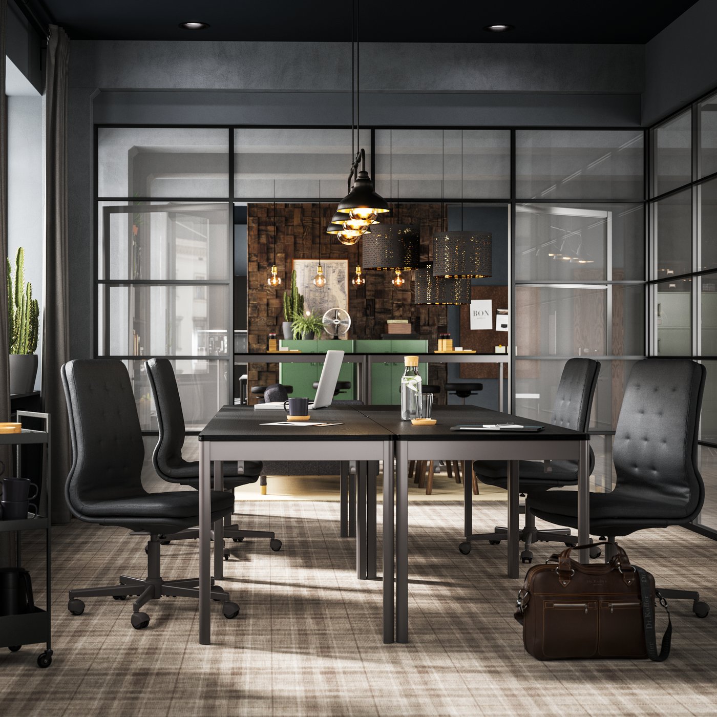 Four black/dark grey IDÅSEN tables with dark grey chairs shown in a conference room with glass walls.