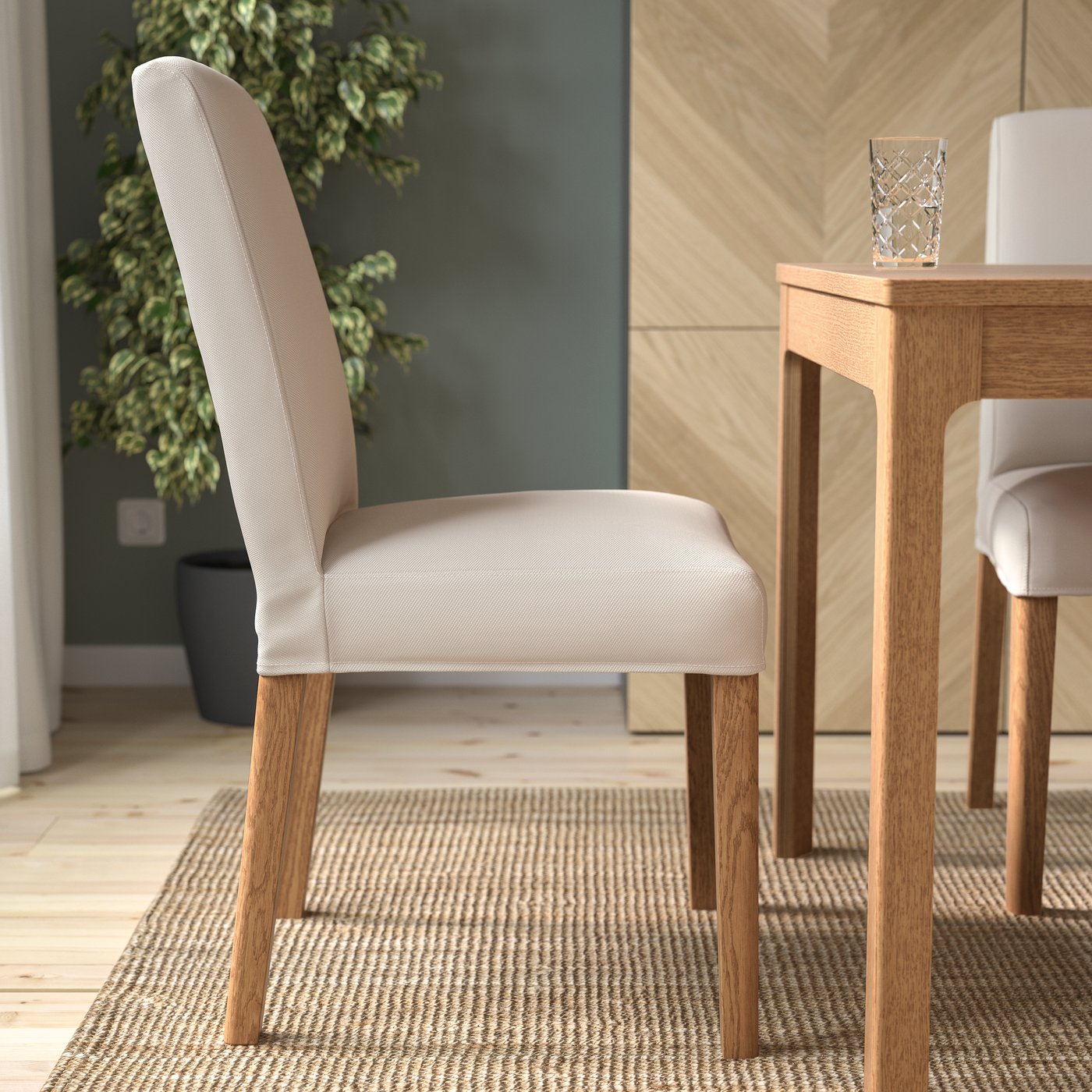 An oak effect/Hallarp beige BERGMUND chair in the dining room