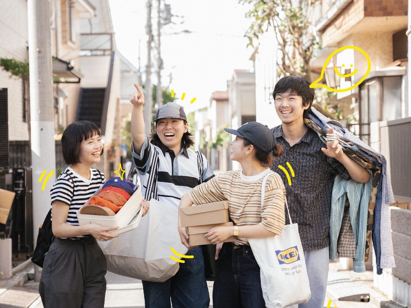 A group of friends walking down the street, carrying boxes and bags filled with clothes and shoes.