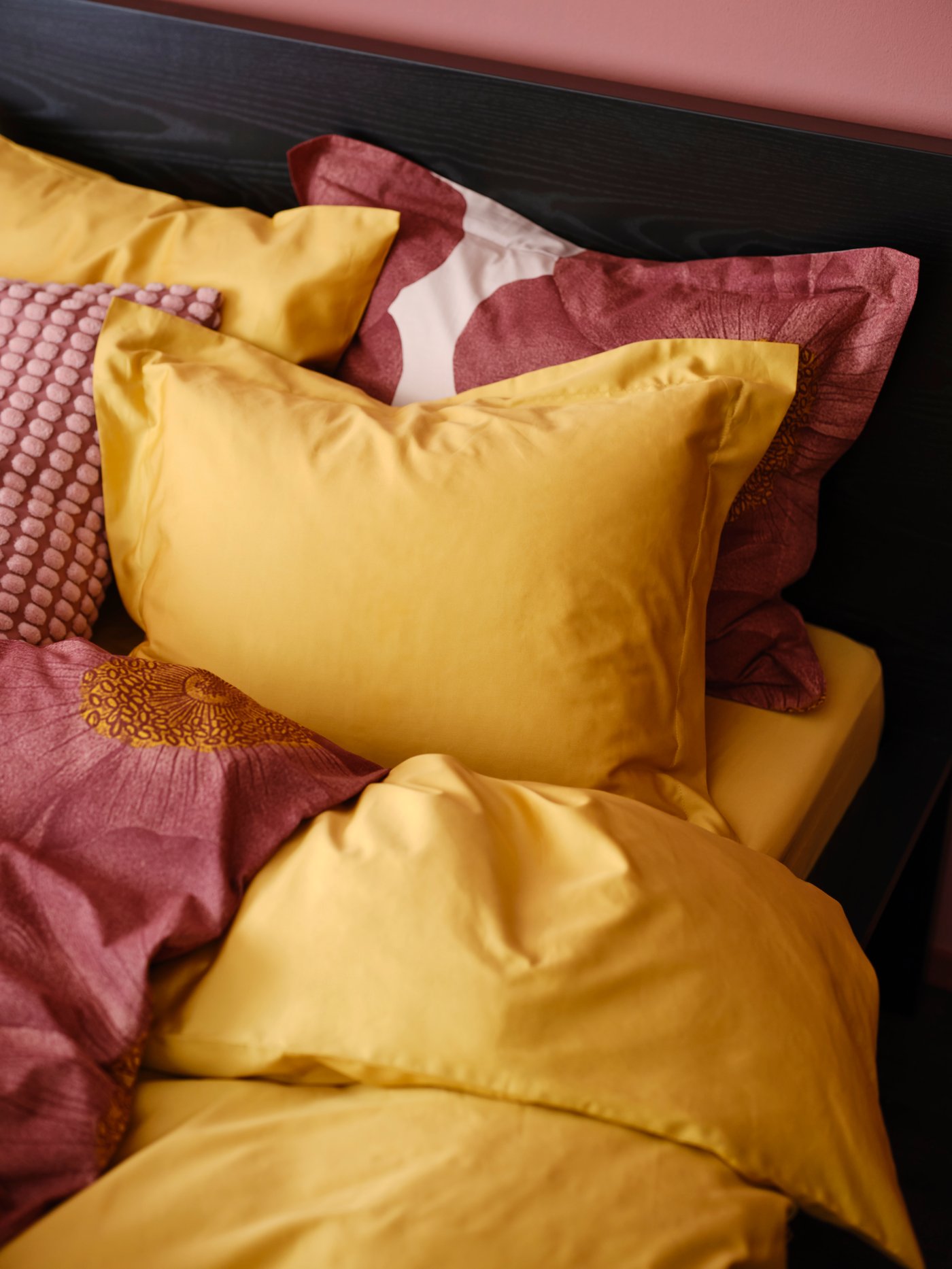 An yellow LUKTJASMIN duvet cover and pillowcase