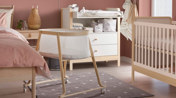 A birch/white ÄLSKVÄRD cot