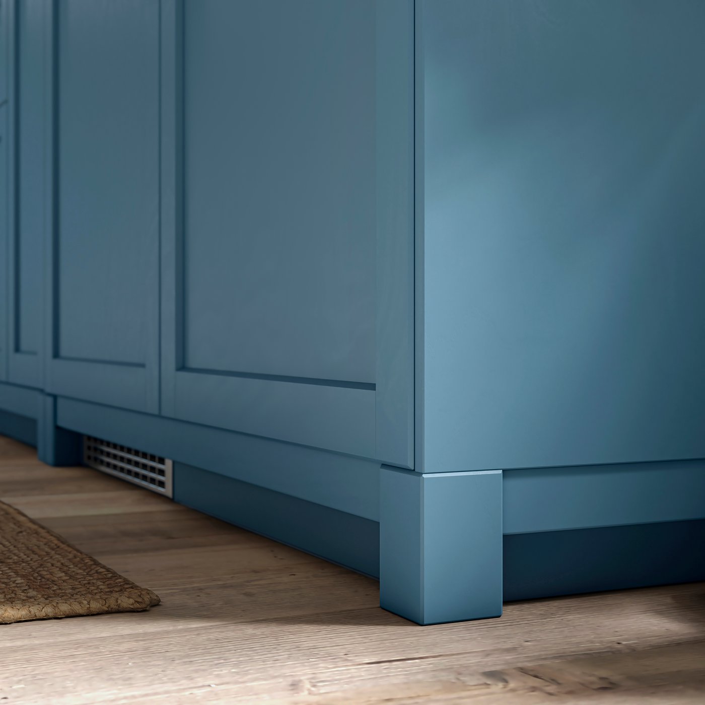 A closeup of legs and plinths in matching LERHYTTAN blue for SEKTION kitchen cabinets for a crafted, built-in kitchen look.