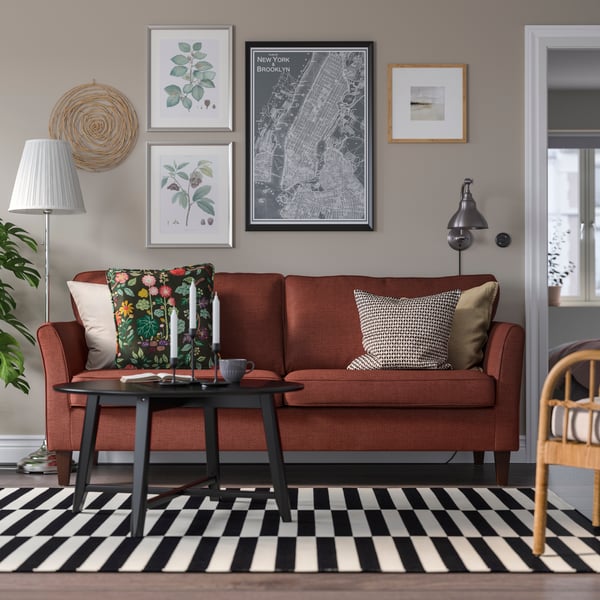 A Kilanda brown-red EKHOLMA 3-seat sofa in the living room