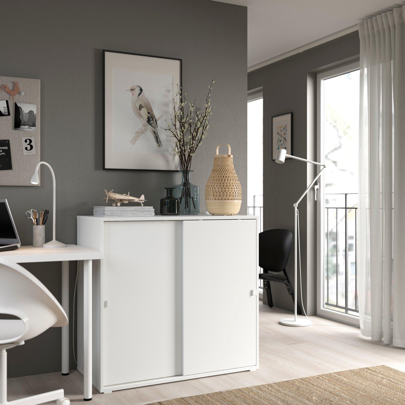 A white VIHALS cabinet with sliding doors